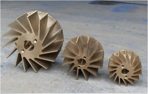 Original supplied photograph of three impellers, with their original blades and bore geometry